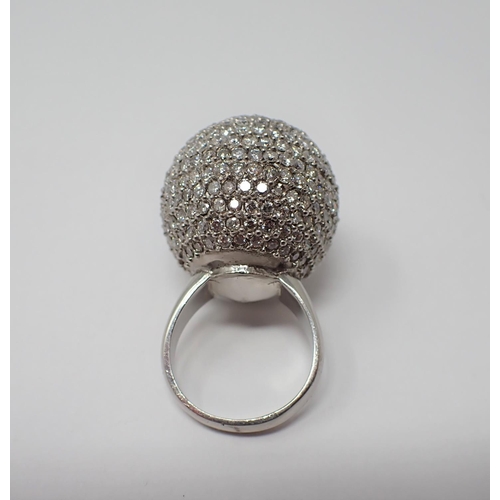 173 - A Diamond Cocktail Ring pavé-set numerous brilliant-cut stones to 'glitter ball' in palladium, ring ... 