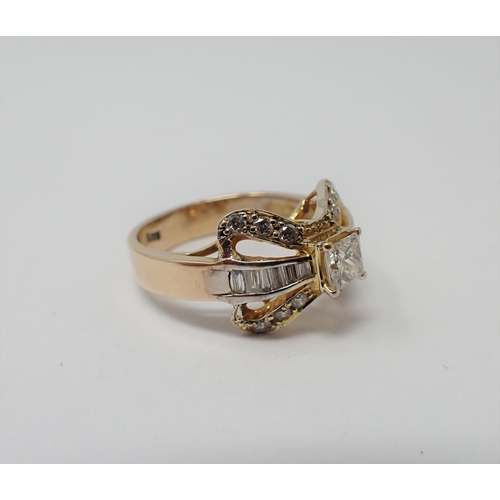 174 - A Diamond Bow Ring claw-set princess-cut stone between channel-set baguettes and pavé-set brilliant-... 