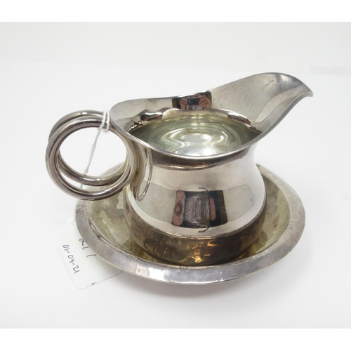 217 - A modern silver Milk Jug with loop handle, and Stand, Birmingham 2000