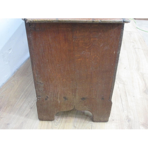 23 - A 17th Century oak six plank Sword Chest or Coffer on cupid's bow shaped end supports, the top with ... 