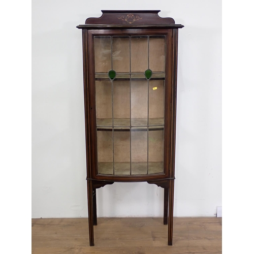 28 - An Edwardian mahogany and inlaid lead glazed bow fronted Display Cabinet fitted single door mounted ... 