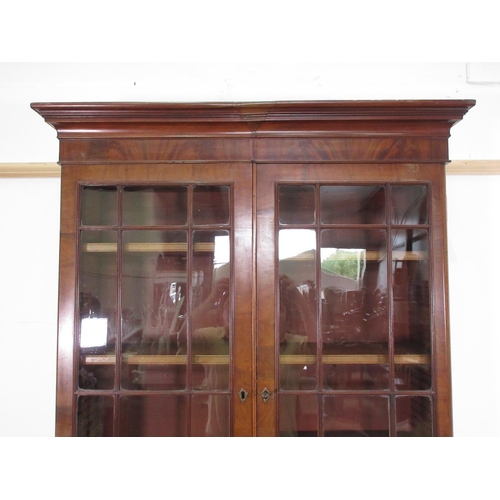 3 - A 19th Century mahogany and glazed Bookcase above base fitted pair of cupboard doors (converted from... 