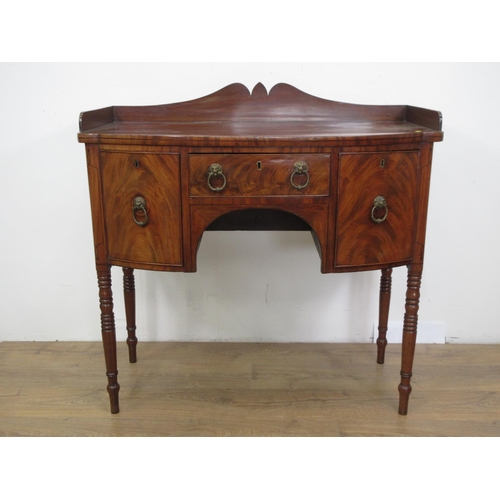 305 - A 19th Century mahogany Sideboard with shaped gallery fitted three drawers mounted upon turned suppo... 