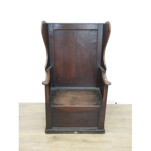 315 - An 18th Century oak wing back Lambing Chair fitted drawer to base 4ft 1in H x 2ft 7in W