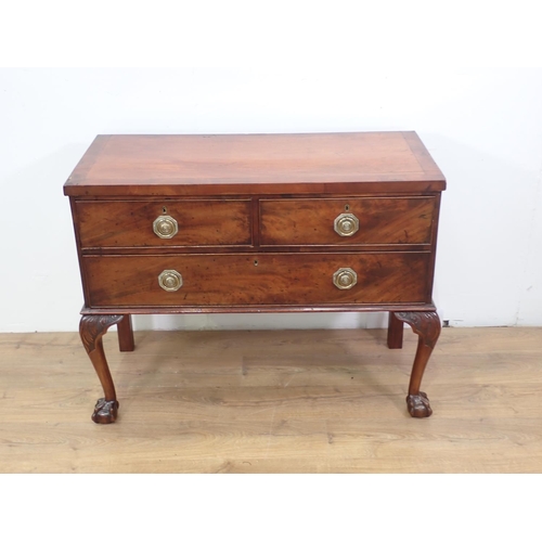 317 - A 19th Century mahogany Chest of two short and one long drawer mounted upon cabriole supports and cl... 