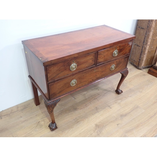 317 - A 19th Century mahogany Chest of two short and one long drawer mounted upon cabriole supports and cl... 