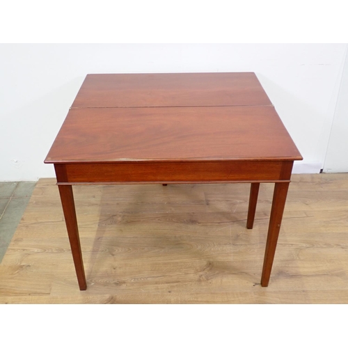 32 - A 19th Century mahogany fold-over Tea Table mounted upon square cut supports 3ft W x 2ft 5in H