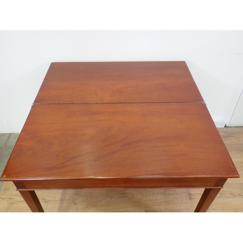 32 - A 19th Century mahogany fold-over Tea Table mounted upon square cut supports 3ft W x 2ft 5in H