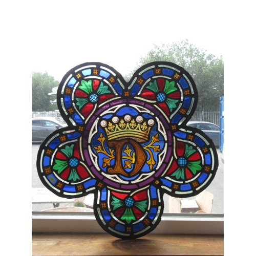 346 - An antique stained glass Window with Crown design within five petals 2ft W x 1ft 11in H