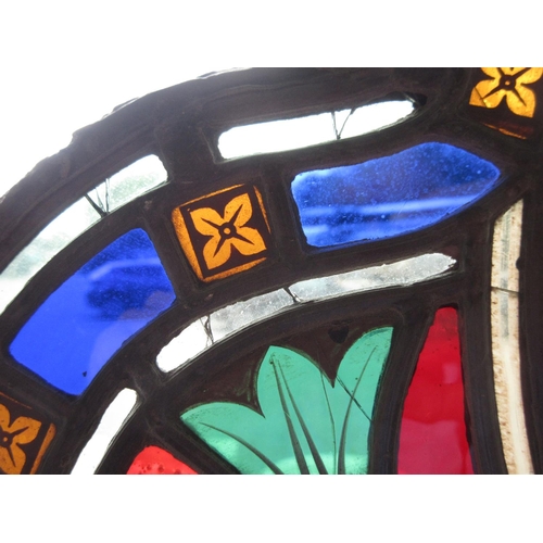 346 - An antique stained glass Window with Crown design within five petals 2ft W x 1ft 11in H