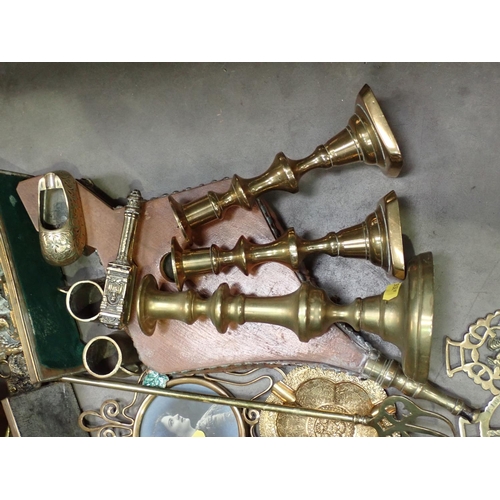 355 - A box of brass ware including pair of Candlesticks, Horse Brasses, Ash Tray, Fire Irons, Letter Rack... 