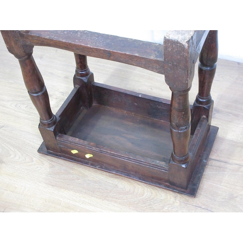 36 - An 18th Century oak Joint Stool with moulded pegged top upon turned supports united by surrounding s... 