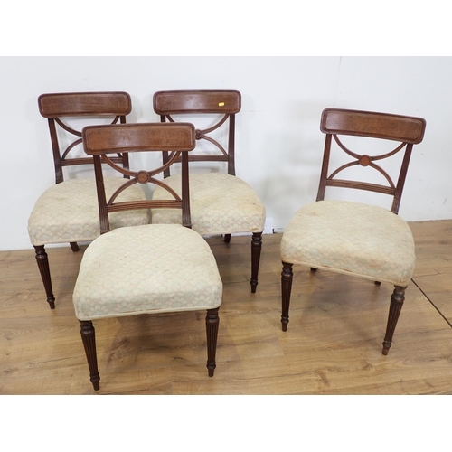 381 - A set of four 19th Century mahogany Dining Chairs with X-frame backs and cream stuff over seats