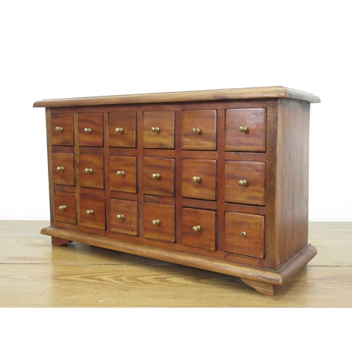 39 - A 20th Century hardwood bank of drawers 2ft 2in W x 1ft 3in H