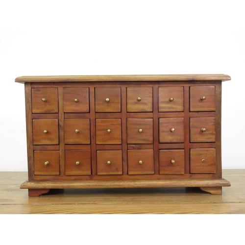 39 - A 20th Century hardwood bank of drawers 2ft 2in W x 1ft 3in H