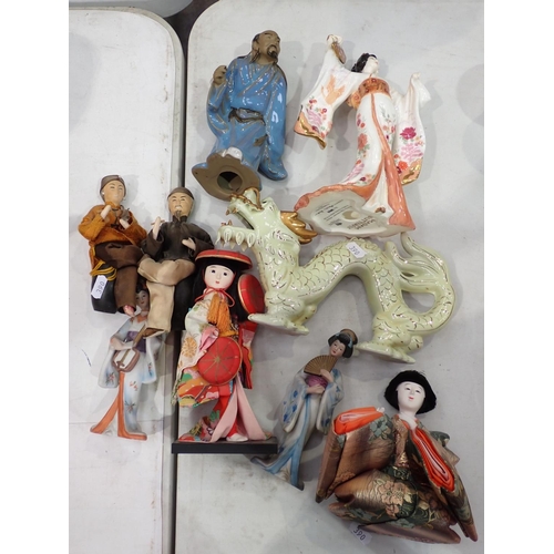 390 - A quantity of Oriental ceramic Figures and Dolls