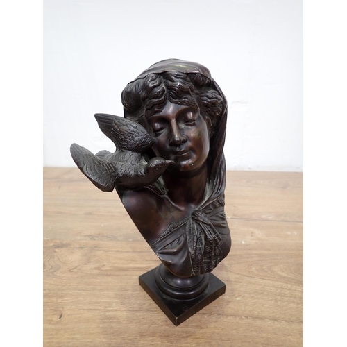 418 - An Art Deco bronze effect Sculpture of a girl and a Bust of a Girl with dove