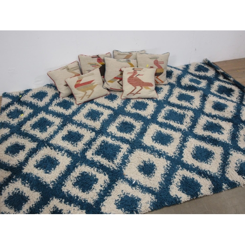 426 - Seven Cushions and a modern woollen Rug