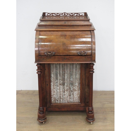 454 - A Victorian walnut veneered Davenport with roll top enclosing fitted interior above glazed cupboard ... 