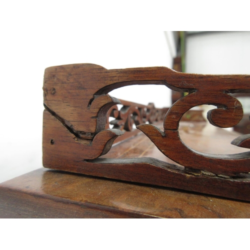 454 - A Victorian walnut veneered Davenport with roll top enclosing fitted interior above glazed cupboard ... 