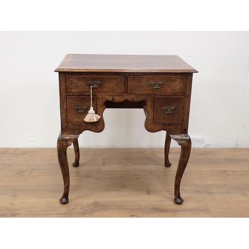 48 - An 18th Century style walnut veneered Low Boy fitted three drawers mounted upon cabriole supports an... 