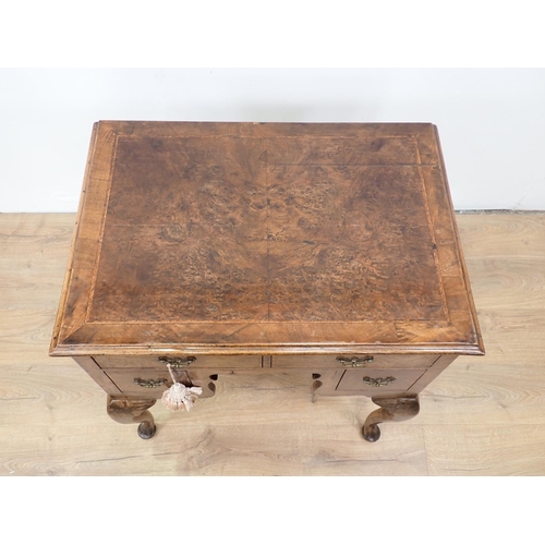 48 - An 18th Century style walnut veneered Low Boy fitted three drawers mounted upon cabriole supports an... 