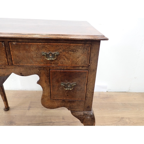 48 - An 18th Century style walnut veneered Low Boy fitted three drawers mounted upon cabriole supports an... 