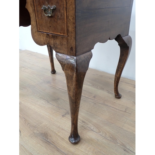 48 - An 18th Century style walnut veneered Low Boy fitted three drawers mounted upon cabriole supports an... 