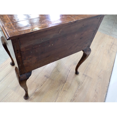 48 - An 18th Century style walnut veneered Low Boy fitted three drawers mounted upon cabriole supports an... 