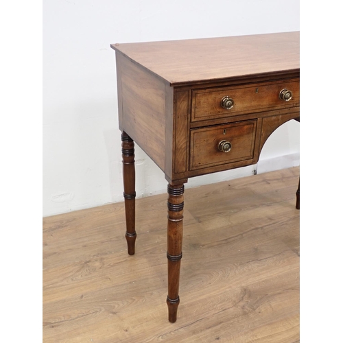 55 - A Regency mahogany and ebonised strung Side Table fitted four drawers mounted upon turned supports 3... 