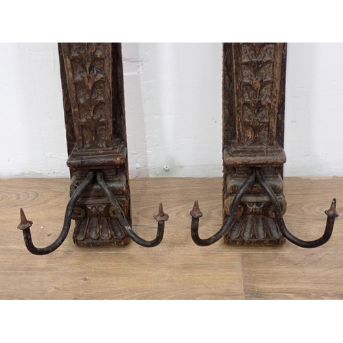 557 - A pair of Continental 17th Century style carved oak Wall Sconces 2ft 2in