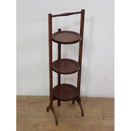 567 - An Edwardian mahogany folding Cake Stand 3ft H