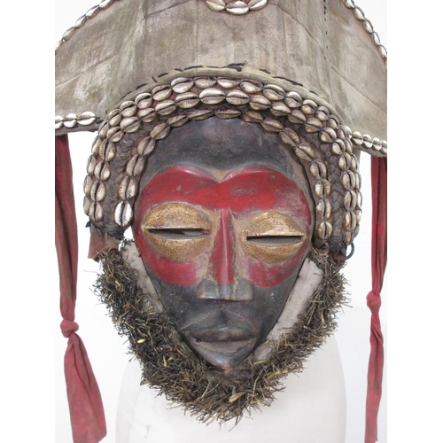 568 - A West African ceremonial Mask with feather head dress