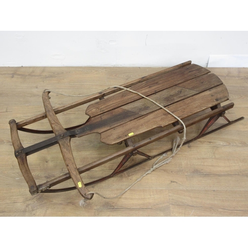 576 - An antique elm Toboggan