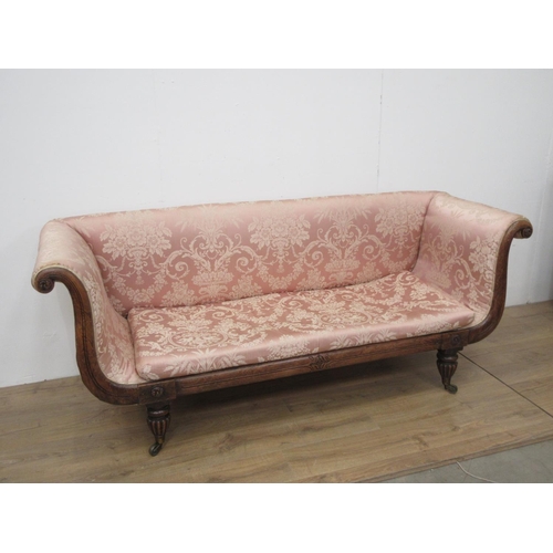 583 - A William IV rosewood and pink upholstered Settee on fluted supports 7ft W x 2ft 9in H