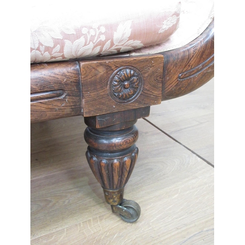 583 - A William IV rosewood and pink upholstered Settee on fluted supports 7ft W x 2ft 9in H