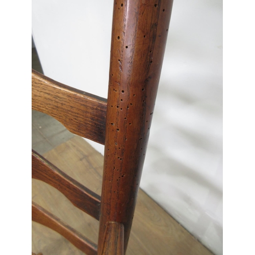 594 - A 19th Century ash ladderback Elbow Chair with wicker seat