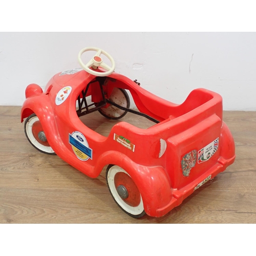 606 - A plastic Noddy type Pedal Car 2ft 3in L