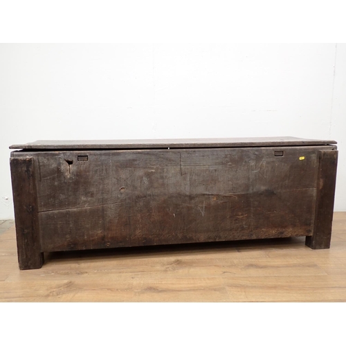 61 - A 17th Century Welsh Borders type oak Coffer of plank construction within dug out supports 5ft W x 1... 