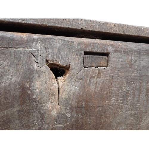 61 - A 17th Century Welsh Borders type oak Coffer of plank construction within dug out supports 5ft W x 1... 