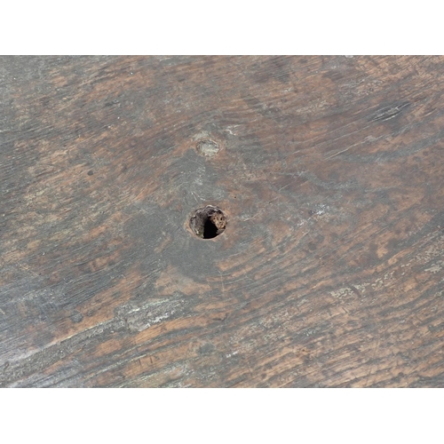 61 - A 17th Century Welsh Borders type oak Coffer of plank construction within dug out supports 5ft W x 1... 