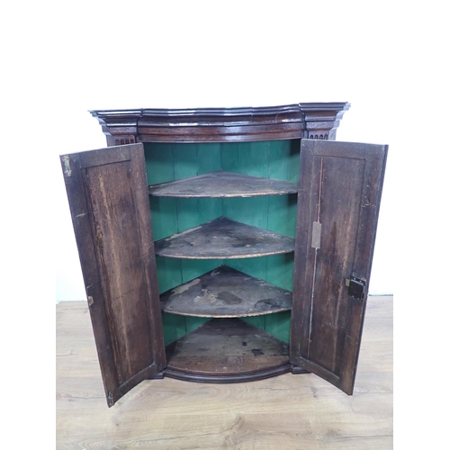 610 - A 19th Century oak bow fronted Corner Cupboard 3ft 11in H x 3ft W