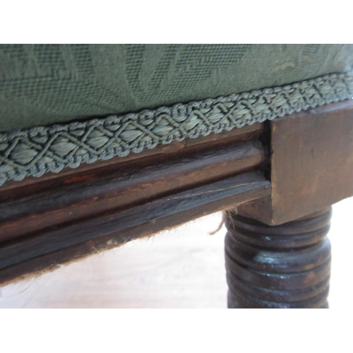 618 - A Victorian green upholstered Armchair on turned supports