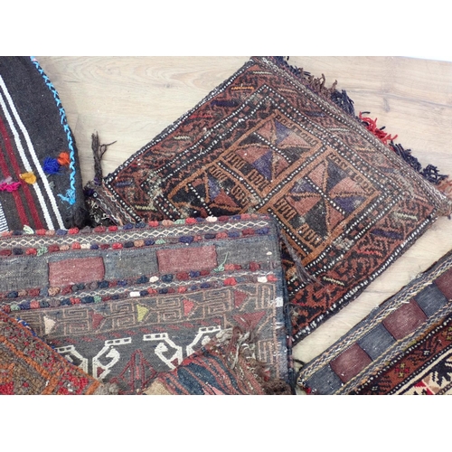 626 - Five North African carpet Saddle Bags and a Cushion