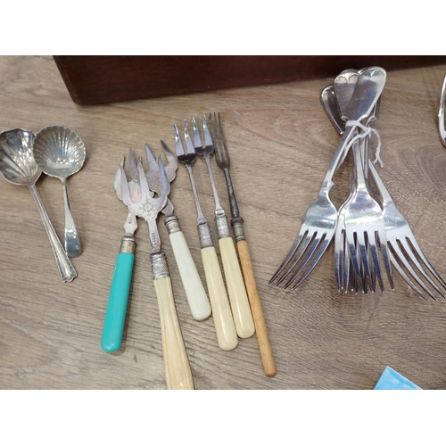 630 - An oak Canteen of Cutlery, another Canteen of stainless Cutlery and a box of Postcards