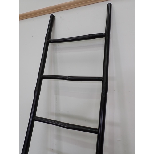 643 - A black painted wooden Ladder 7ft 1in L x 1ft 4in W