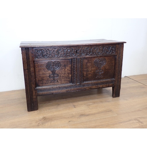 65 - A 17th Century oak Coffer with tulip carved two panel front 3ft 5in W x 2ft 1in H