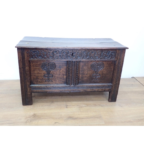 65 - A 17th Century oak Coffer with tulip carved two panel front 3ft 5in W x 2ft 1in H