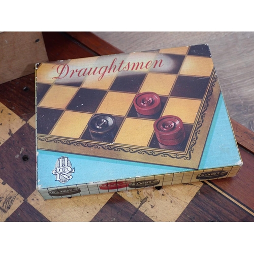 650 - A mahogany Games Board with two sets of draughts