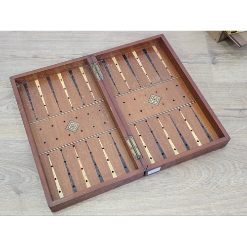 650 - A mahogany Games Board with two sets of draughts